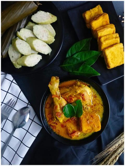 Delicious Indonesian opor ayam served with rice ca