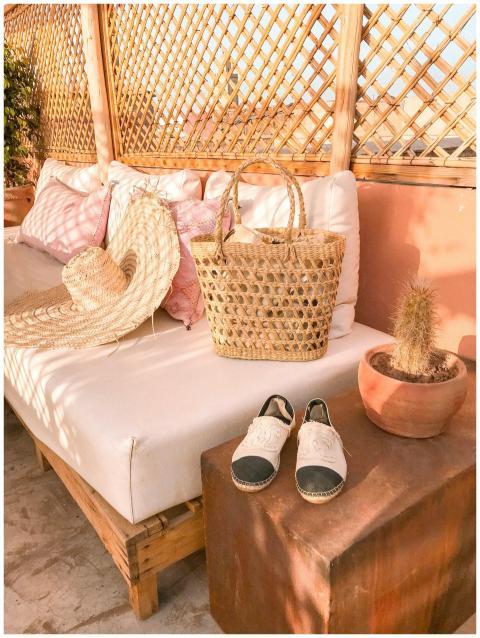 A summer-themed patio setup featuring a wicker bag