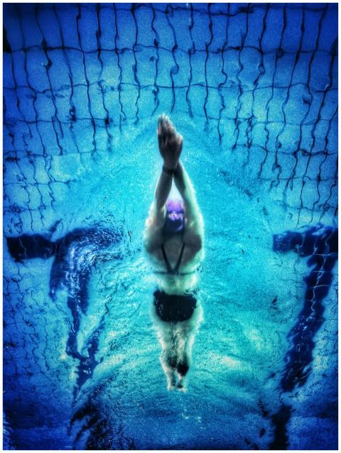Captivating underwater shot of a swimmer in a pool