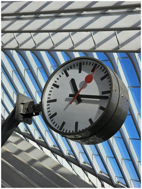A modern clock displaying time inside Liège-Guille