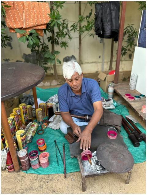 Craftsman creating vibrant bangles in a traditiona