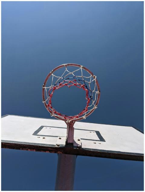 Low angle view of a basketball hoop and backboard
