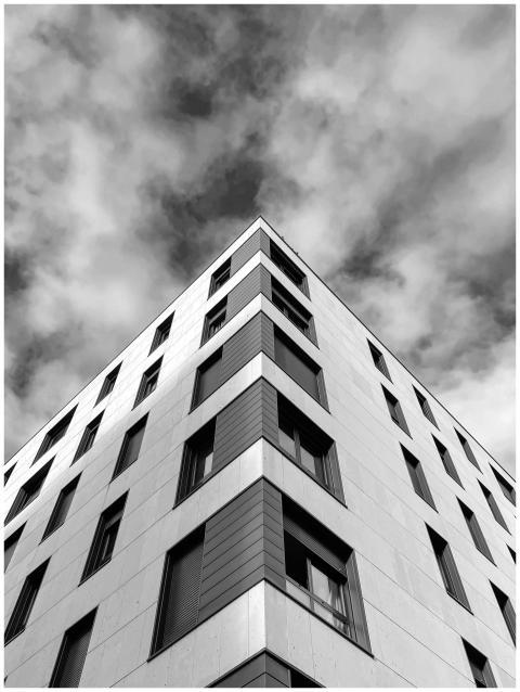Black and white photo capturing a modern building