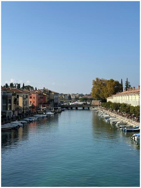 Beautiful canal scene in an Italian town with colo