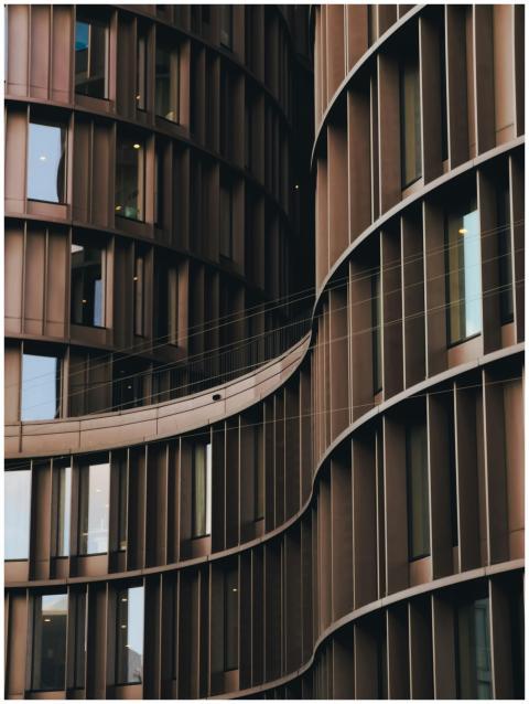 Close-up view of modern curved building architectu