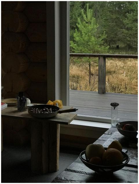 Rustic wooden cabin interior with bowls of food, o