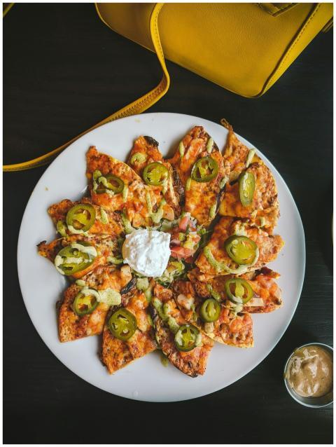 A mouth-watering shot of loaded nachos topped with