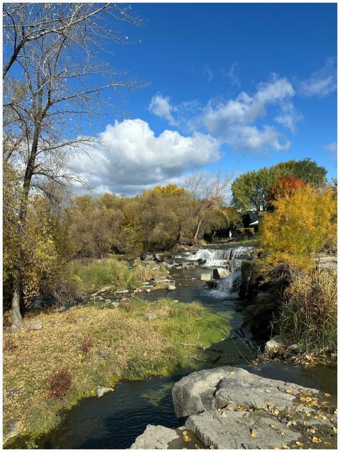 Beautiful autumn landscape with waterfall and colo
