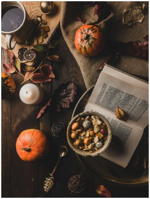 Warm and rustic autumn scene with pumpkins, tea, a