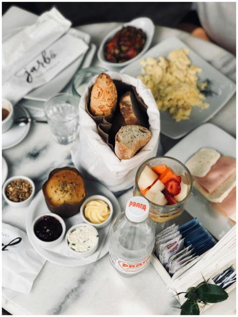 A stylish brunch setup featuring bread, pastries,
