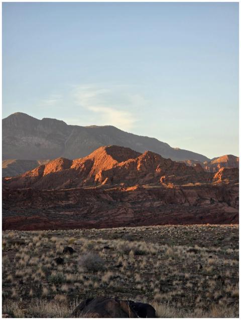 Stunning sunrise over red rock mountains with clea
