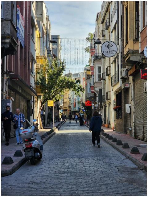 Explore a bustling street in Beyoglu, Istanbul, wi
