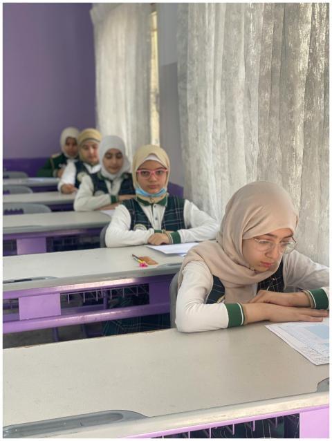 Middle Eastern teenage girls studying in a classro