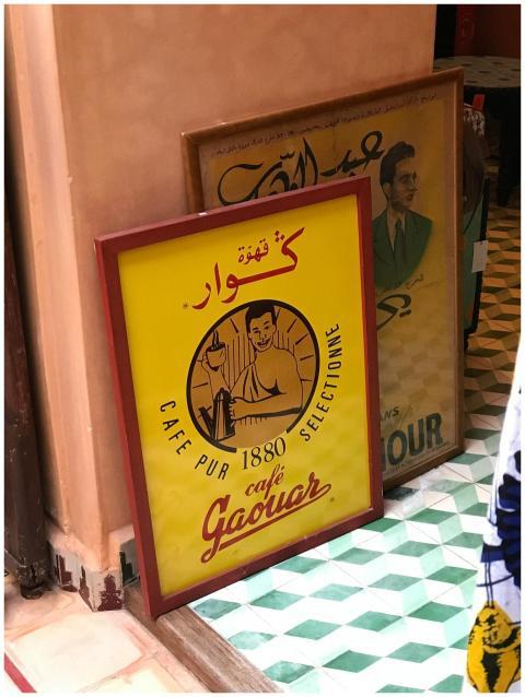 Colorful vintage cafe posters in Marrakesh, showca