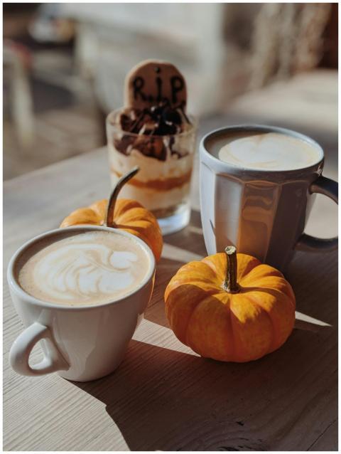 Warm autumn coffee scene with pumpkins and Hallowe
