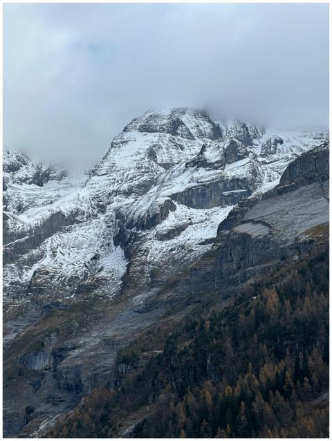 Majestic snow-covered mountain peaks with a layer