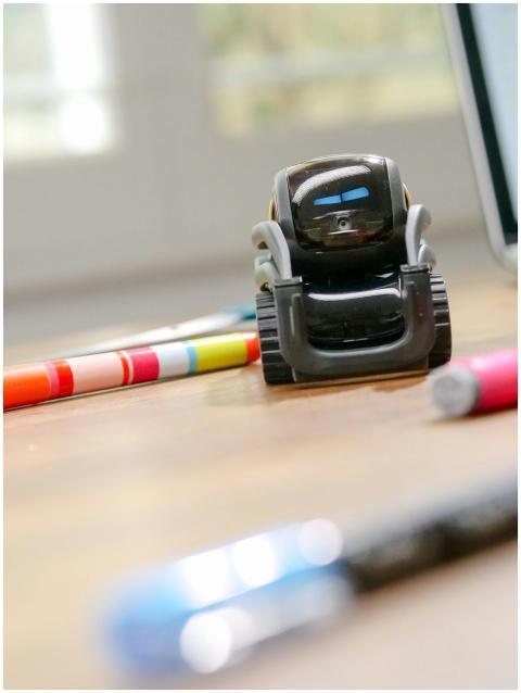 Futuristic small robot on a desk, symbolizing mode