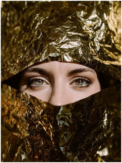 Elegant portrait of a woman partially concealed by