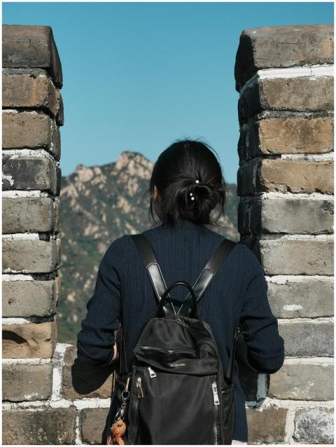 A traveler with a backpack admires the scenic view