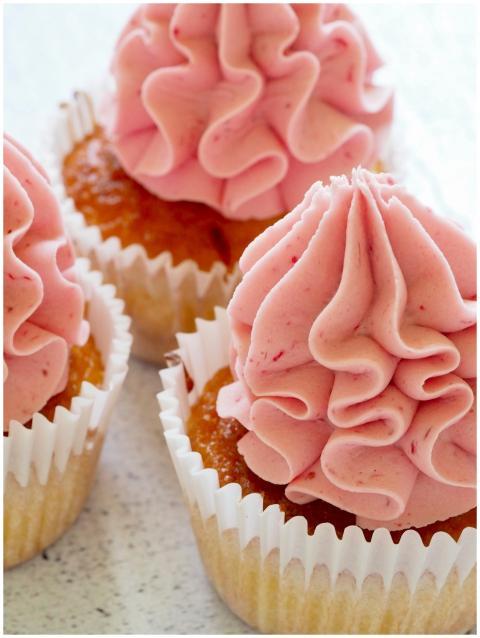 Tasty cupcakes with pink frosting, perfect for a s