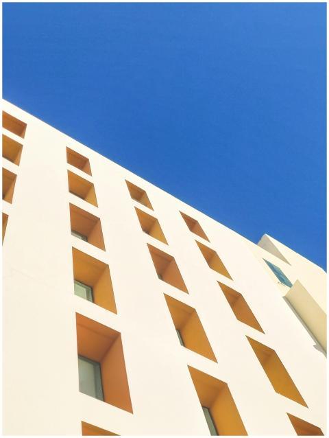 Low angle view of a modern building facade with ge