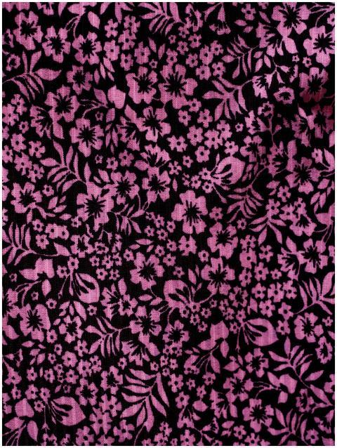 Detailed view of pink floral pattern on fabric, id