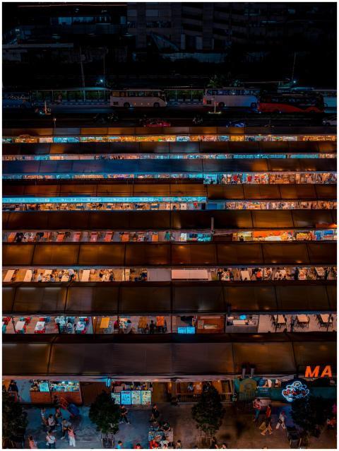 Vibrant aerial shot of a bustling Bangkok night ma