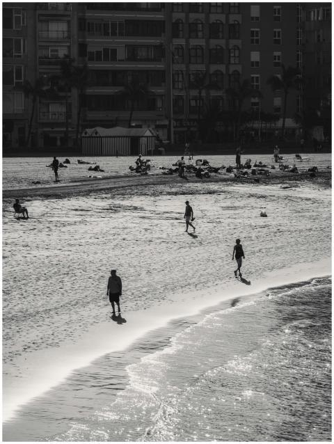 A black and white photograph of people enjoying a