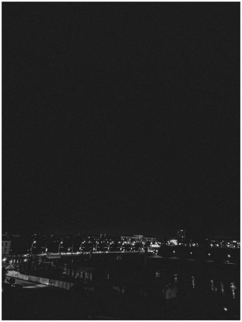 Black and white cityscape of Hrodna at night with