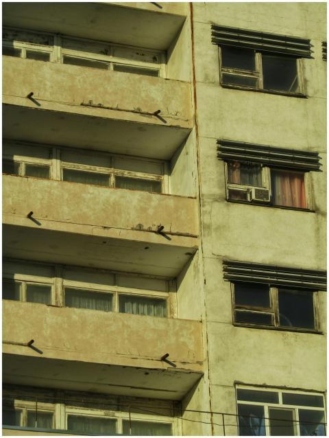 Close-up of an aged urban apartment building with