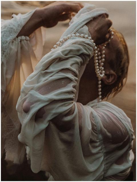 Intriguing close-up of a person draped in white fa