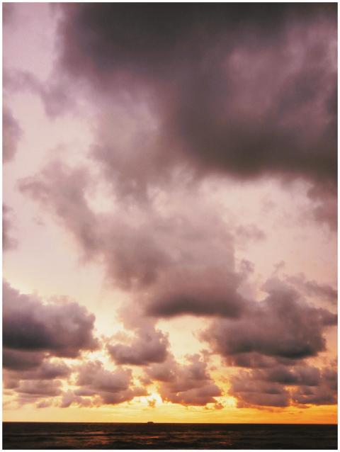 A stunning sunset with dramatic clouds over the oc