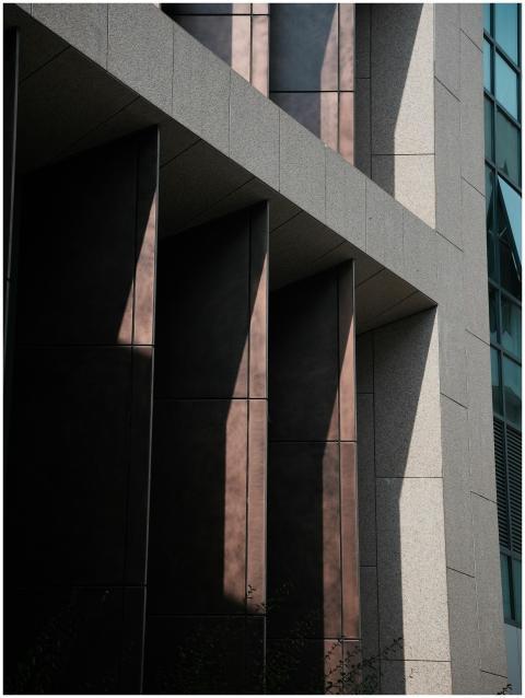 Contemporary building facade with dramatic shadows