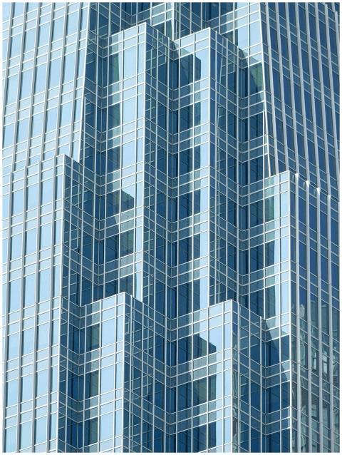 Close-up of a modern skyscraper with a geometric g