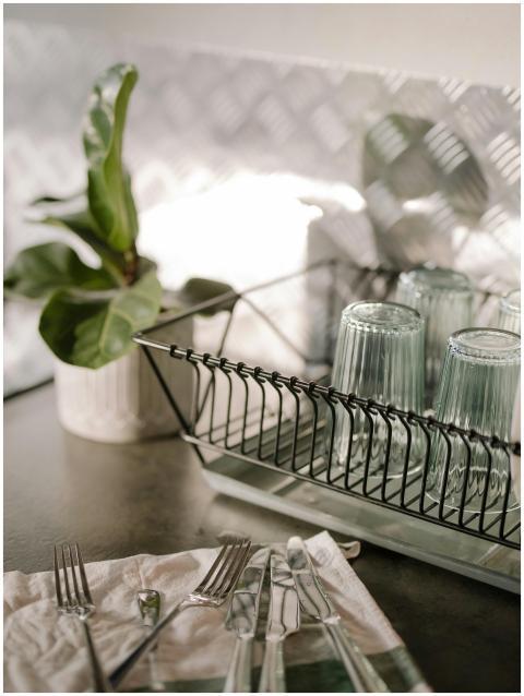 Elegant kitchen setting with a dish rack, glasses,