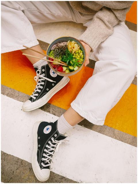 Casual outdoor setting with vibrant poke bowl and