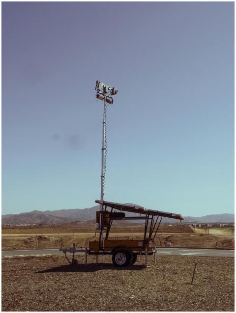 A portable light tower powered by solar panels sta