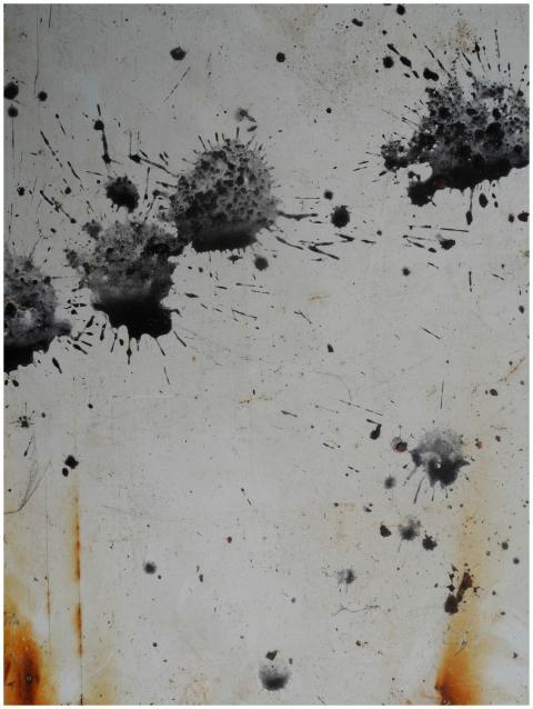 Artistic abstract image of rust and black splatter