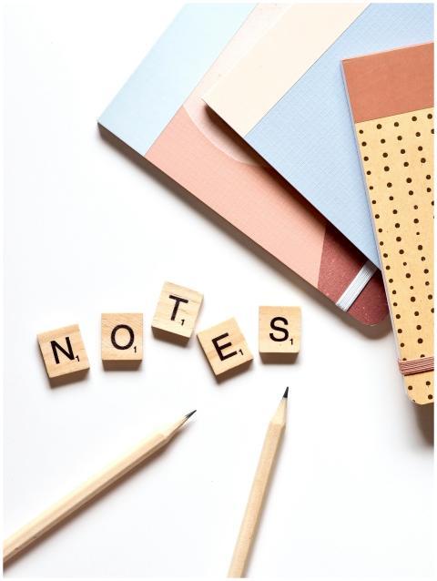 Close-up of educational supplies and wooden alphab