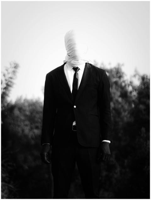A surreal black and white photo of a person in a s
