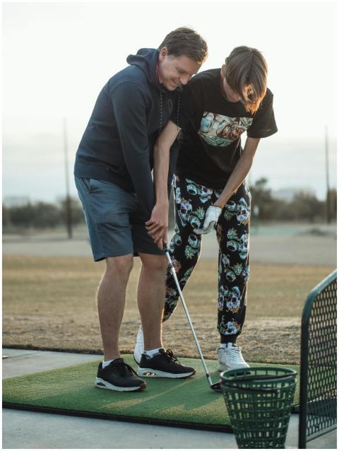 A father and teenage son bonding while practicing