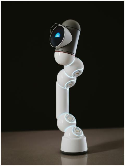 A humanoid robot with a camera-like lens, showcasi