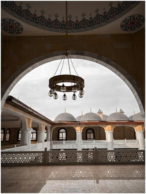 A beautifully lit mosque interior showcasing intri