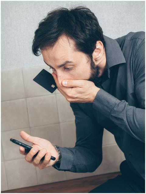 Man in shock discovering possible fraud or data br