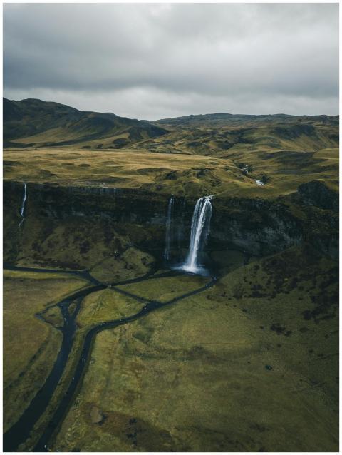 Dramatic aerial view of an Icelandic waterfall cas