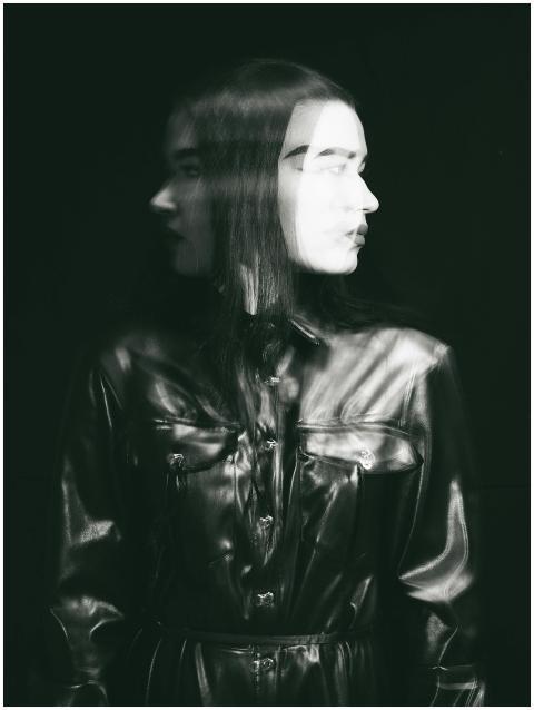 Artistic black-and-white double exposure of a woma