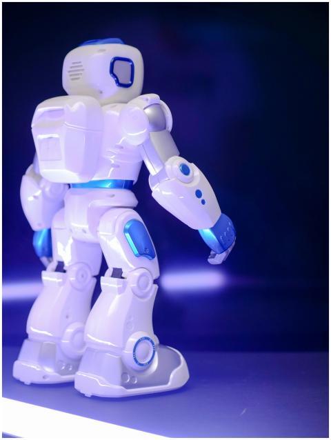 Modern humanoid robot with blue luminescent featur