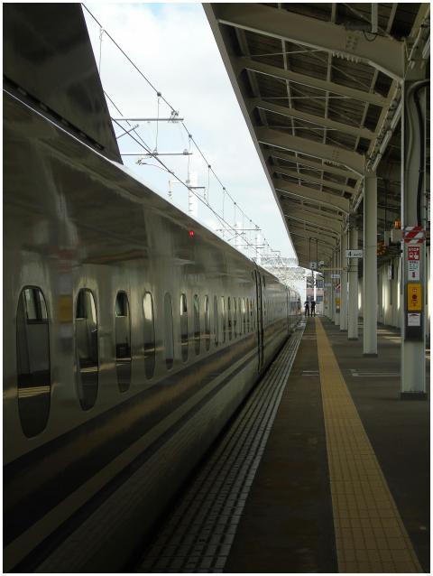 High-speed train at station platform with modern a