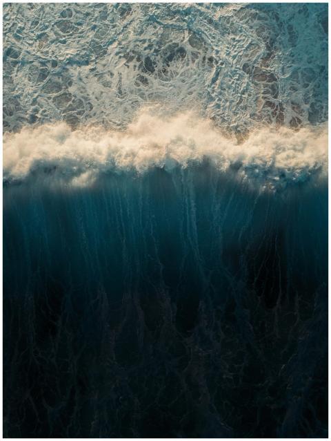 Stunning aerial capture of ocean waves crashing an