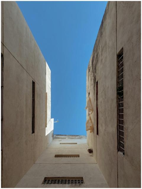 A striking upward view of an urban residential bui